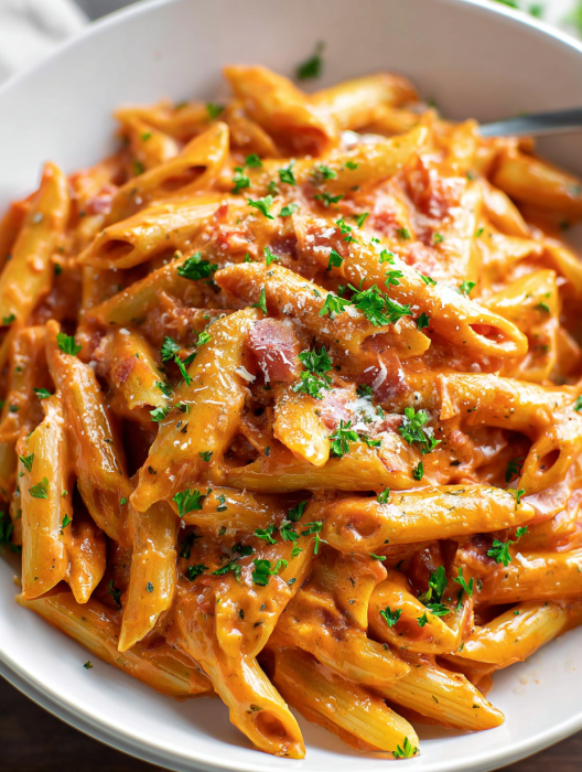 A plate of pasta with meat and cheese.