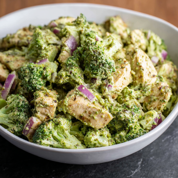 A bowl of pesto chicken and broccoli salad.