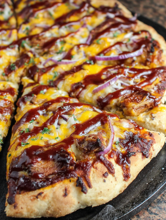 A pizza with cheese and onions.