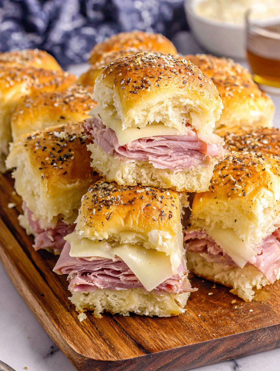 A plate of sandwiches with meat and cheese.