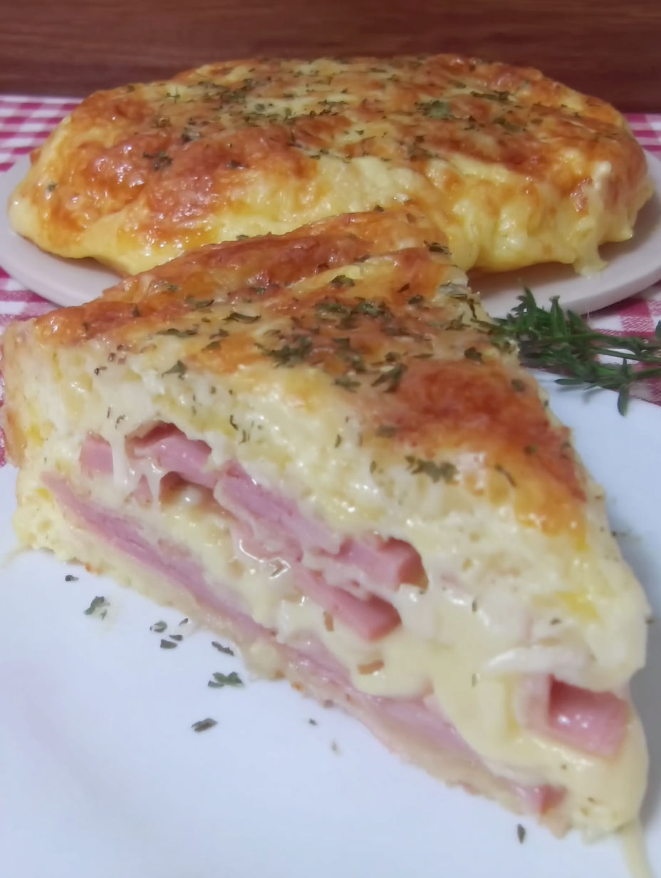 A slice of moelleux à la raclette on a plate.