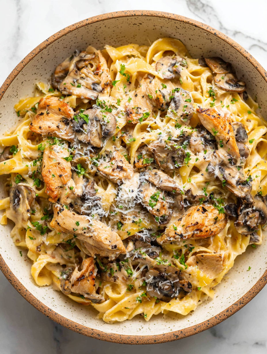 A bowl of chicken marsala pasta.