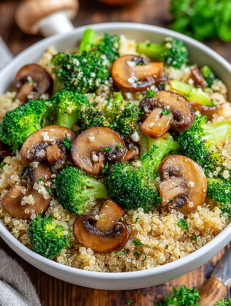 A bowl of food with mushrooms and broccoli.