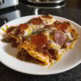 A plate of pizza enchiladas.