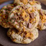 A plate of thick and chewy peanut butter butterfinger cookies.