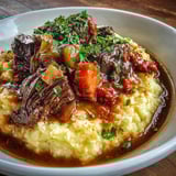 A plate of food with meat and vegetables.