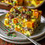 A slice of a sweet potato and egg casserole.