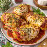 A plate of baked ricotta chicken.