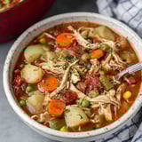 A bowl of chicken and vegetable soup.