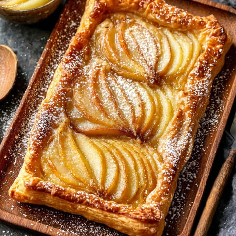 A pastry with a filling of apples and sugar.