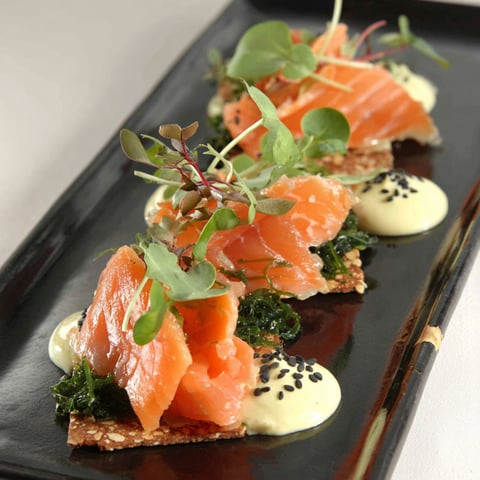 A plate of food with a gin-tonic sauce.