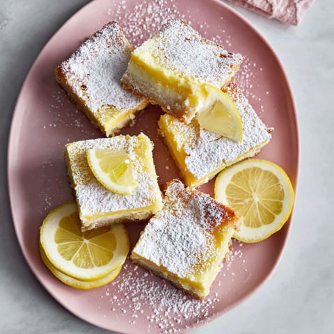 A plate of cream cheese lemon bars.