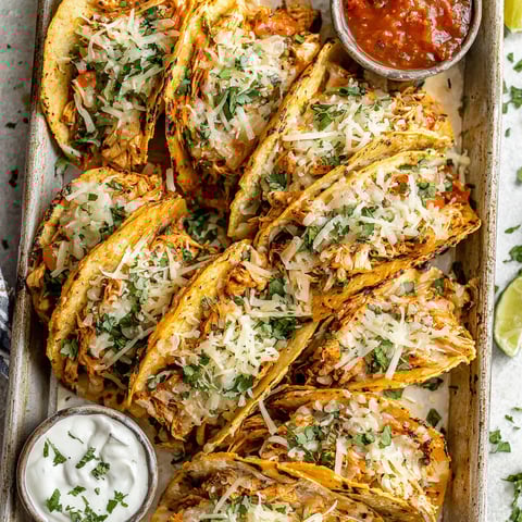 A tray of mini baked chicken tacos.