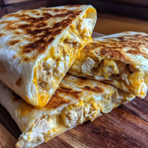 A cheesy quesadilla is ready to be eaten.