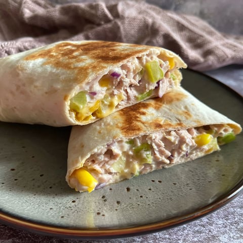 A tuna melt wrap on a plate.