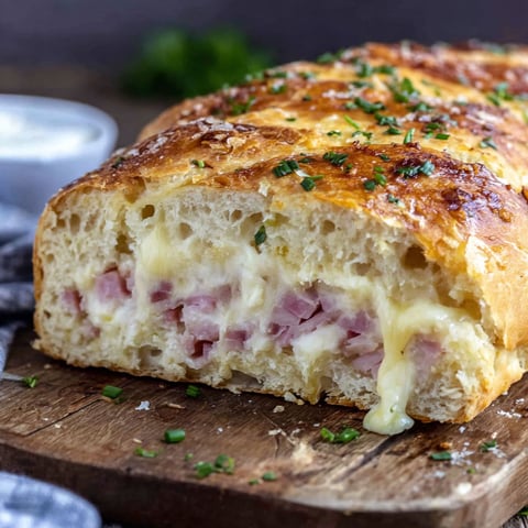 A slice of bread with ham and cheese.
